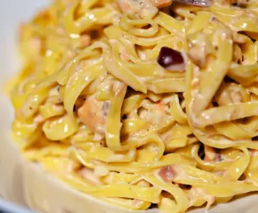 Creamy salmon linguine served with fresh herbs and lemon