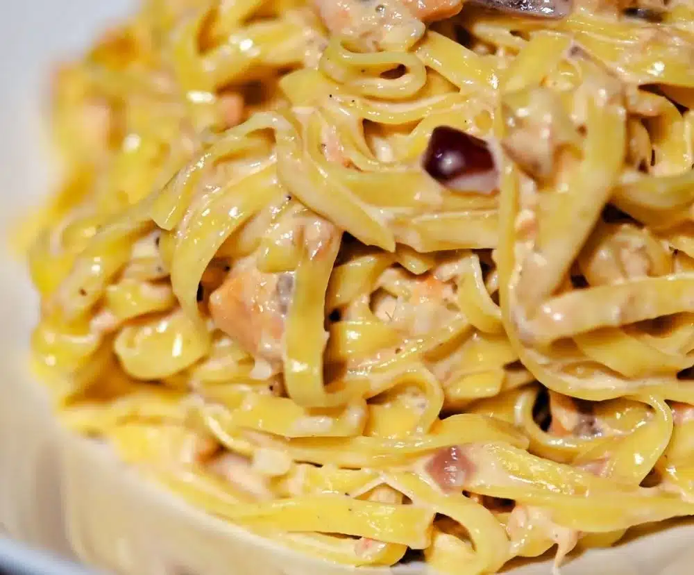 Creamy salmon linguine served with fresh herbs and lemon