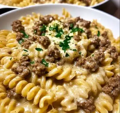 Plate of Beef Rotini in creamy garlic Parmesan sauce garnished with parsley