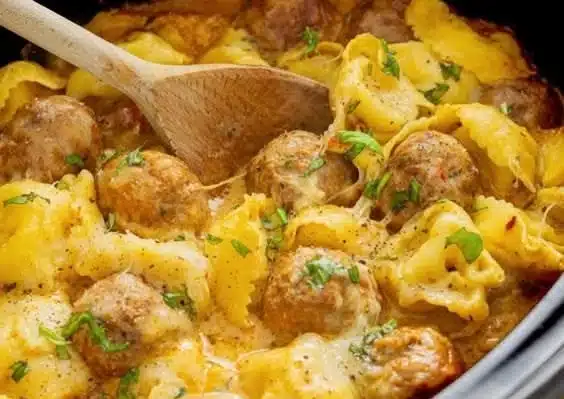 Crock Pot Meatballs served with Tortellini in a savory sauce