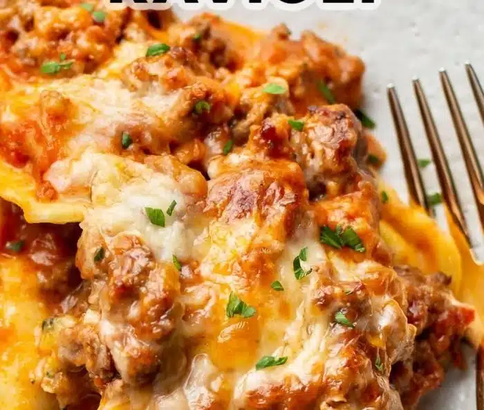 Easy cheesy baked ravioli dish with melted cheese and marinara sauce