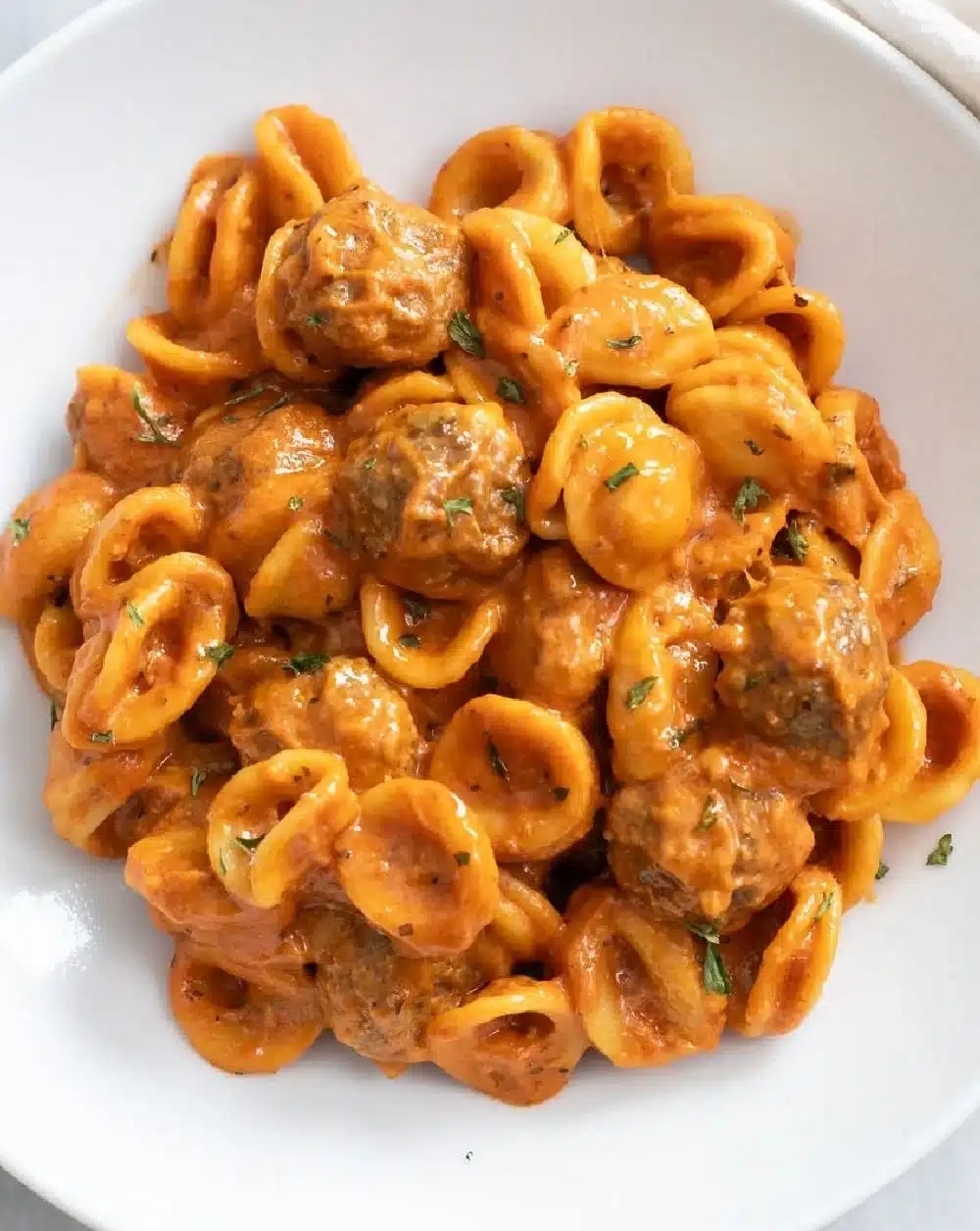 Delicious meatball pasta dinner with fresh ingredients and sauce.