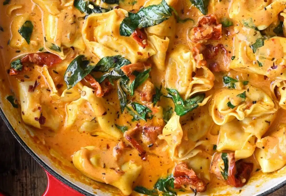 One-Pot Marry Me Tortellini dish served in a bowl with fresh herbs